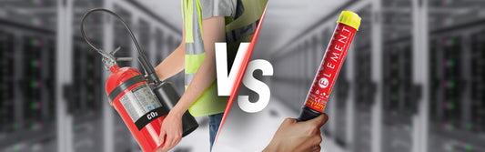 Side-by-side comparison of a traditional CO2 fire extinguisher being handled by a worker versus a compact Element fire extinguisher held in a home setting, highlighting size and design differences.