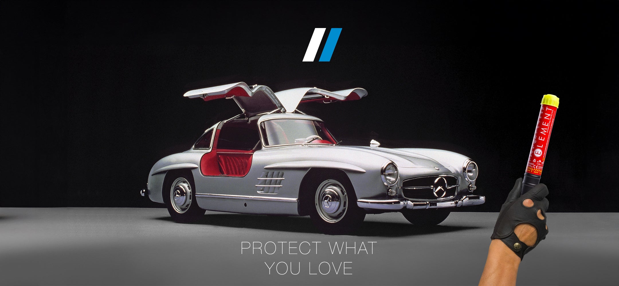 Mercedes Gullwing sitting in a gallery with its doors flung open. Protect your collectors car with Element.